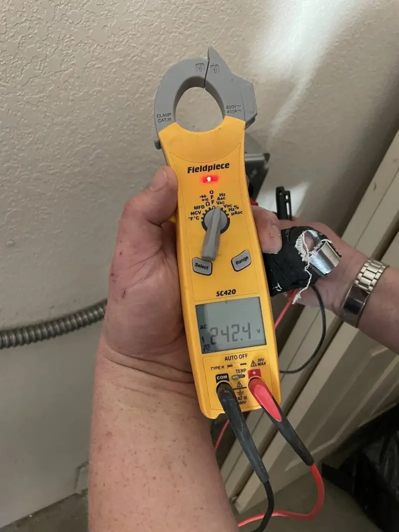 Voltage testing with clamp meter during Aluminum Wiring Replacement in North Kingstown